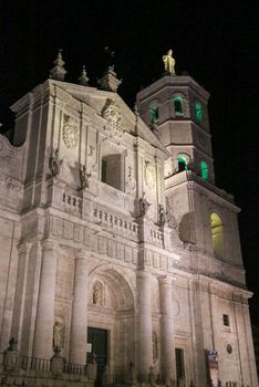 The illuminated Diocese church of Valladolid at night in Spain
