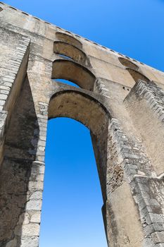 The arches of the Roman Aqueduct Aqueduto da Amoreira in Elvas in Portugal