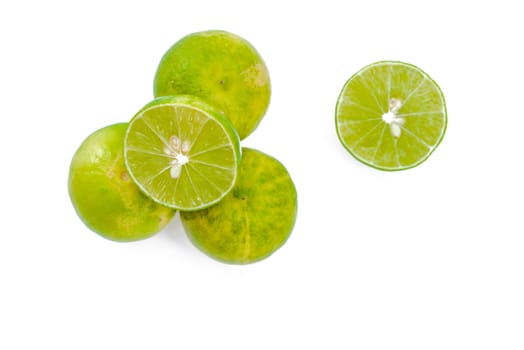 Juicy slices of lime isolated on white background.