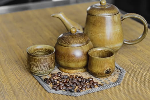 Soft focus image of coffee beans and coffee cups set on wooden background.Vintage style.(soft focus)