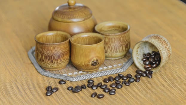 Soft focus image of coffee beans and coffee cups set on wooden background.Vintage style.(soft focus)