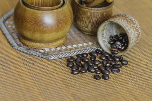 Soft focus image of coffee beans and coffee cups set on wooden background.Vintage style.(soft focus)