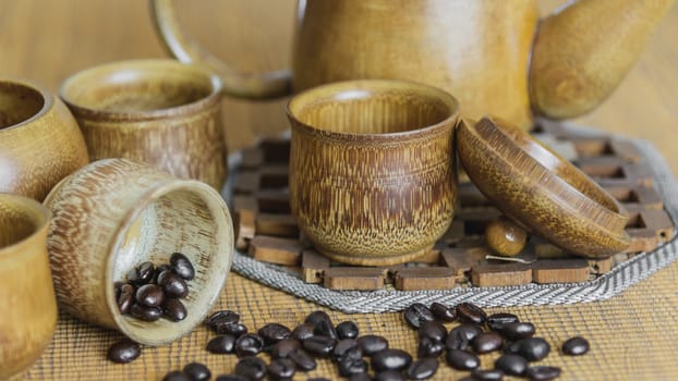 Soft focus image of coffee beans and coffee cups set on wooden background.Vintage style.(soft focus)