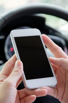 Woman Sitting in the Car and Using Smart Phone