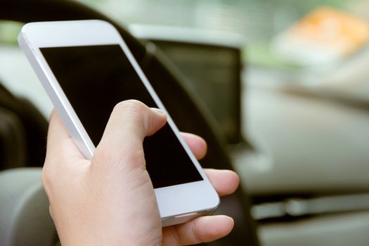 Woman Sitting in the Car and Using Smart Phone