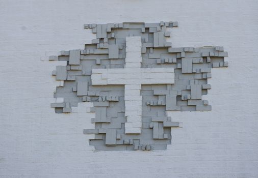 Christian Cross Sign On brick Wall