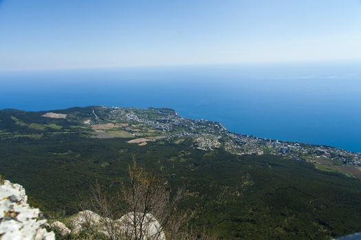 The seashore in the light of the sun from big height