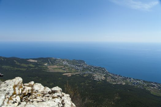 The seashore in the light of the sun from big height