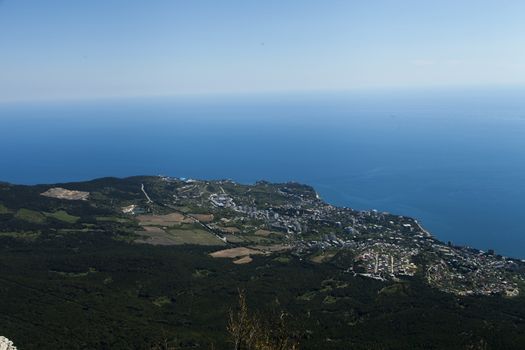 The seashore in the light of the sun from big height