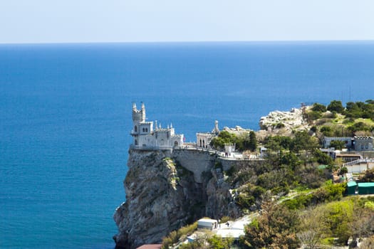 The castle by the sea is on the rock highly above water