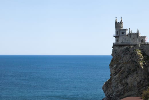 The castle by the sea is on the rock highly above water