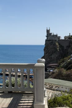 The castle by the sea is on the rock highly above water