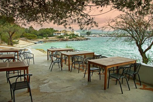Typical terrace of a bar located in the coast of Porto Colom (Mallorca - Spain)