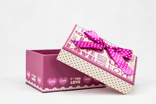 Cute, pink gift box with ribbon and bow