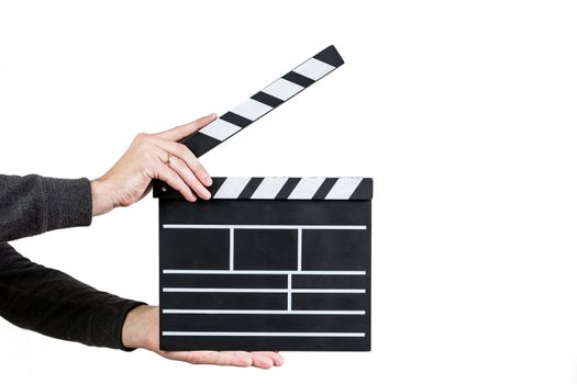 Men ready to clap clapboard on white background