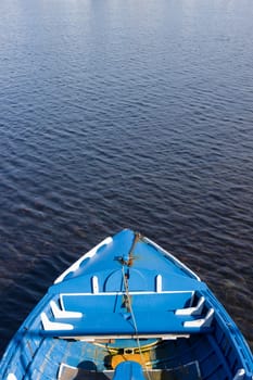 A small blue wooden fishing boat.