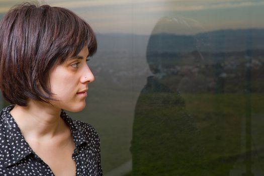 Portrait of a beautiful young woman thinking