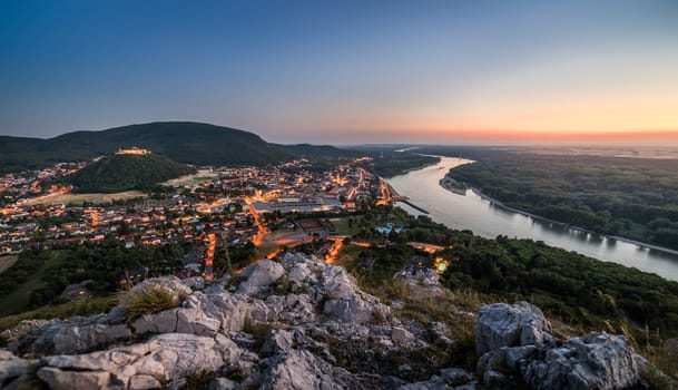 View of Lit Small City of Hainburg an der Donau with Danube River as Seen from Braunsberg Hill at Beautiful Sunset