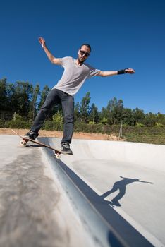 Skateboarder on a slide at the local skatepark.