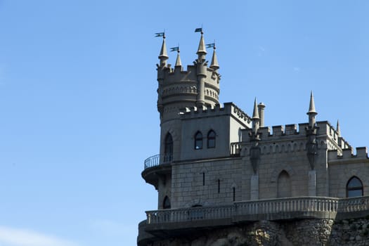 The castle by the sea is on the rock highly above water