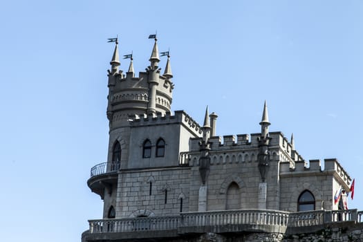 The castle by the sea is on the rock highly above water