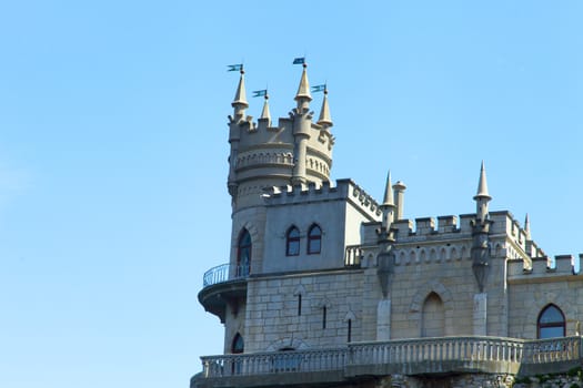 The castle by the sea is on the rock highly above water