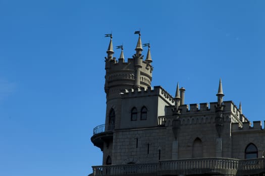 The castle by the sea is on the rock highly above water