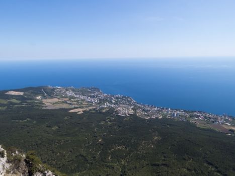 The seashore in the light of the sun from big height