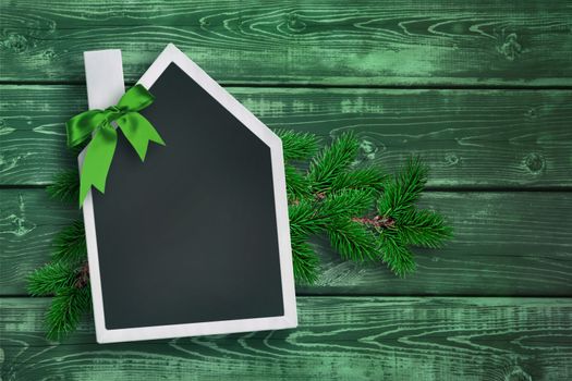 House shaped chalkboard with Christmas background