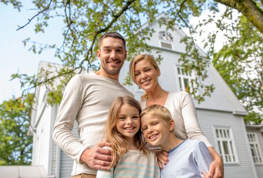 family, happiness, generation, home and people concept - happy family standing in front of house outdoors