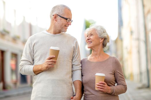 family, age, tourism, travel and people concept - senior couple on city street