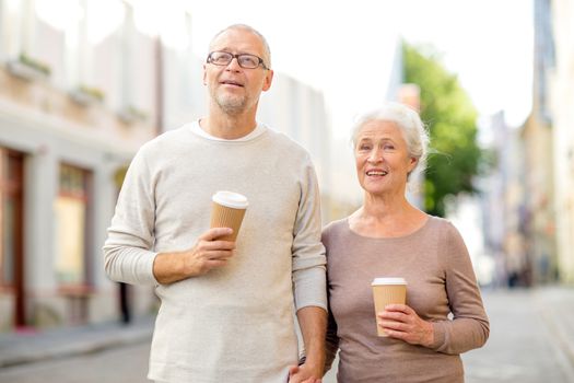 family, age, tourism, travel and people concept - senior couple on city street