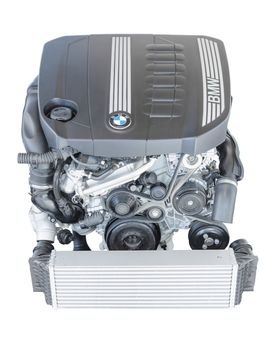 Munich, Germany - September 28, 2014: New modern powerful flagship model of efficient and dynamic car engine. BMW TwinPower turbo 3.0 litre 6-cylinder top-of-the-range diesel powerplant isolated on white.