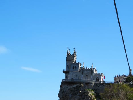 The ancient castle is on the high rock above the sea                               