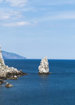 The sea and mountains in beams of a bright sun