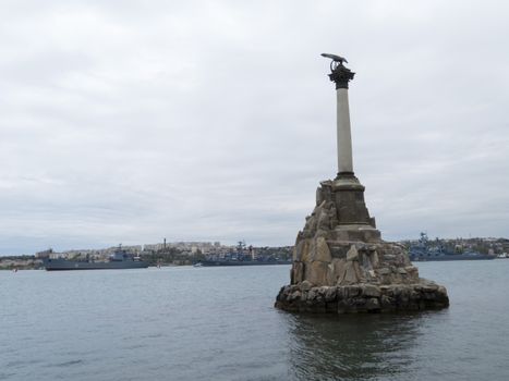 Monument to the flooded Russian ships in a bay