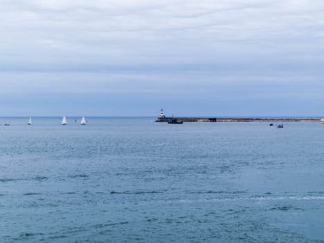 Sea bay in the city in cloudy weather