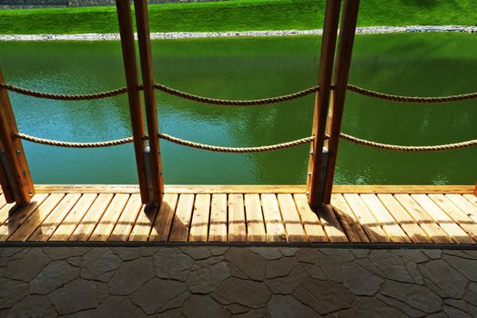 Deck on swimming pool in nature