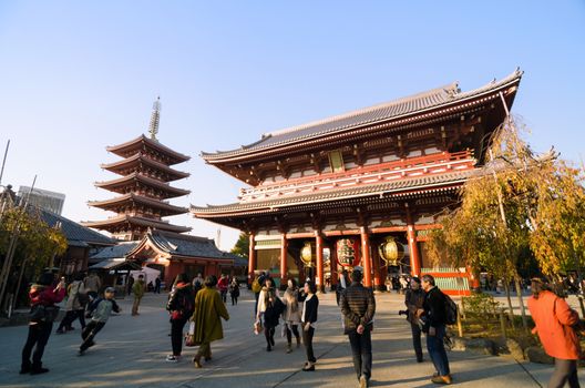 Tokyo, Japan - November 21, 2013: Tourists Visit Buddhist Temple Senso-ji is the symbol of Asakusa and attracting thousands of tourists on November 21, 2013 in Tokyo, Japan. 