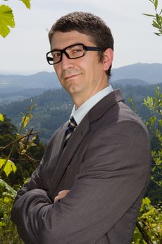 handsome businessman with glasses outdoors