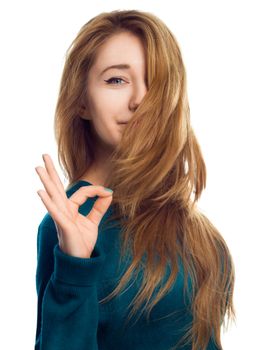 Young beautiful woman is showing OK sign, isolated over white
