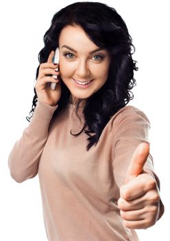 Young woman is showing thumb up gesture, isolated over white
