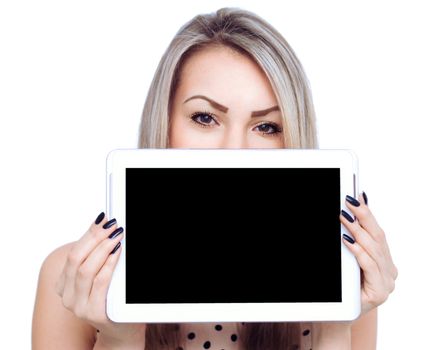 Young cheerful woman is showing blank tablet, isolated over white
