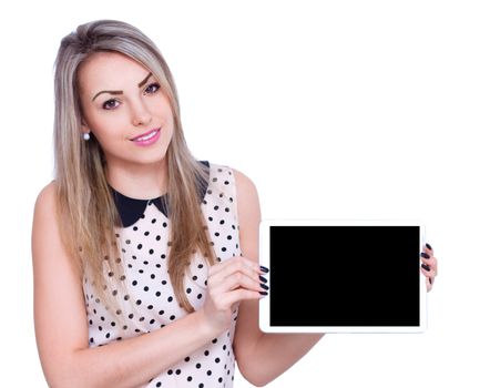 Young cheerful woman is showing blank tablet, isolated over white
