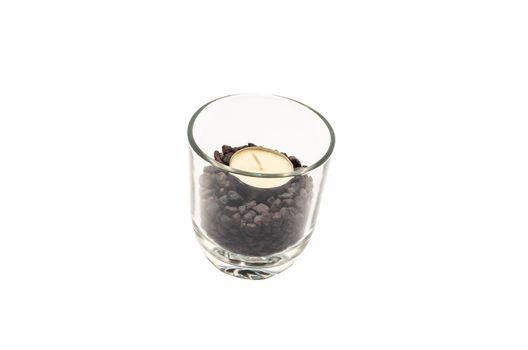 Candle in a transparent glass on a white background