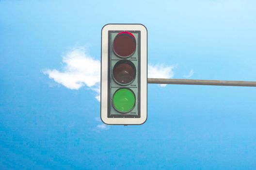 gREEN color on the traffic light with a beautiful blue sky in the background
