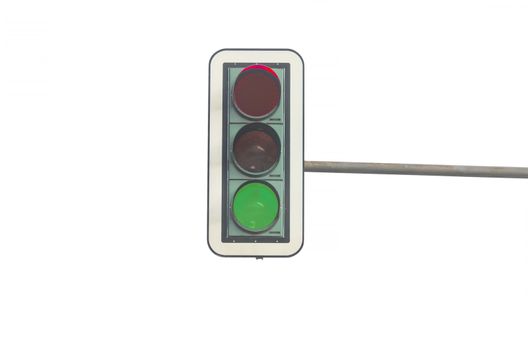 Green color on the traffic light in front of a white background. Symbolizing the beginning and start free ride.