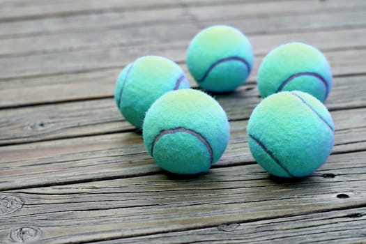 exotic blue tennis ball  on wooden background