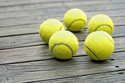 exotic yellow tennis ball  on wooden background