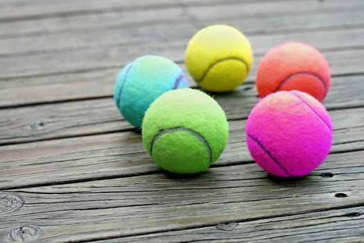 exotic color tennis ball  on wooden background